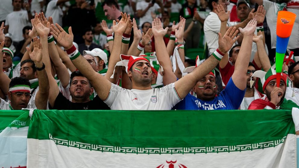 Fans of Iran cheer prior the the World Cup group B soccer match between Iran and the United States at the Al Thumama Stadium in Doha, Qatar, Tuesday, Nov. 29, 2022. (AP Photo/Manu Fernandez)