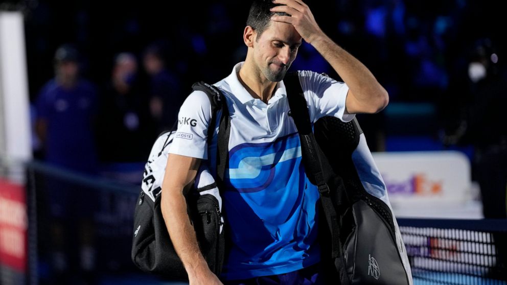 Novak Djokovic of Serbia leaves the court after losing to Alexander Zverev of Germany in their ATP World Tour Finals, singles semifinal, tennis match, at the Pala Alpitour in Turin, Italy, Saturday, Nov. 20, 2021. Zverev won 7-6/4-6/6-3. (AP Photo/Lu