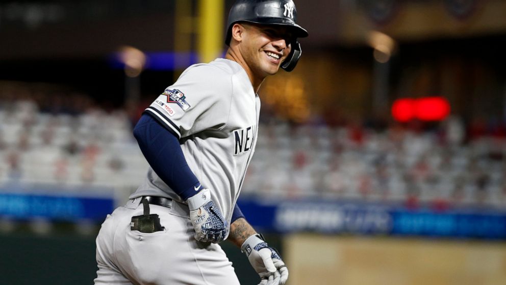 New York Yankees' Gleyber Torres celebrates as he runs the bases after hitting a home run during the second inning in Game 3 of a baseball American League Division Series against the Minnesota Twins, Monday, Oct. 7, 2019, in Minneapolis. (AP Photo/Br
