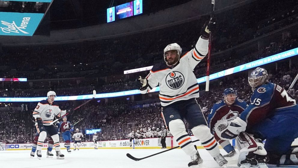 Edmonton Oilers left wing Evander Kane (91) celebrates a goal against Colorado Avalanche goaltender Darcy Kuemper (35) during the first period in Game 1 of the NHL hockey Stanley Cup playoffs Western Conference finals Tuesday, May 31, 2022, in Denver