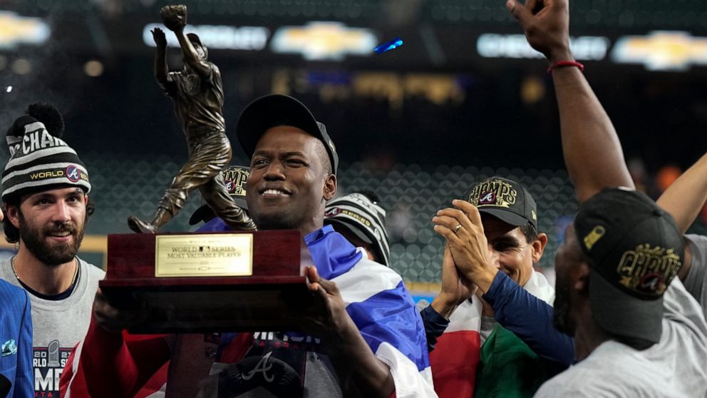 FILE - Atlanta Braves designated hitter Jorge Soler holds up the MVP trophy after winning baseball's World Series in Game 6 against the Houston Astros Tuesday, Nov. 2, 2021, in Houston. The Miami Marlins have been seeking a big bat, and they’re hopin