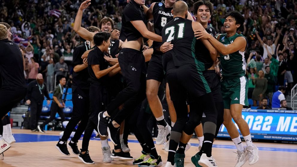 Hawaii players celebrate after defeating Long Beach State to win the NCAA men's college volleyball championship Saturday, May 7, 2022, in Los Angeles. (AP Photo/Marcio Jose Sanchez)