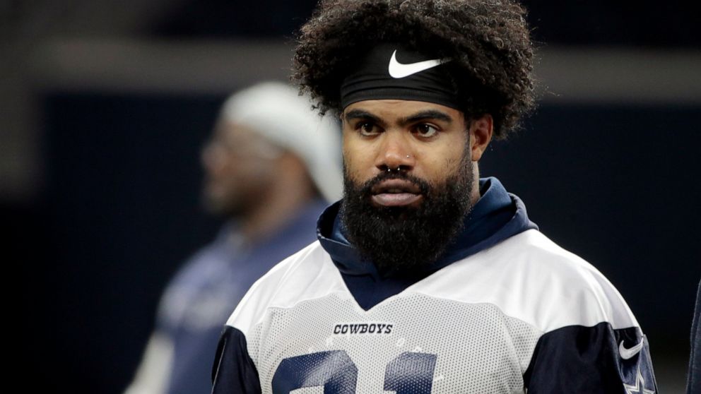 FILE - In this May 22, 2019 file photo Dallas Cowboys running back Ezekiel Elliott (21) walks off the field after NFL football practice in Frisco, Texas. Elliott is vowing to avoid incidents similar to a recent one in Las Vegas that forced the star r