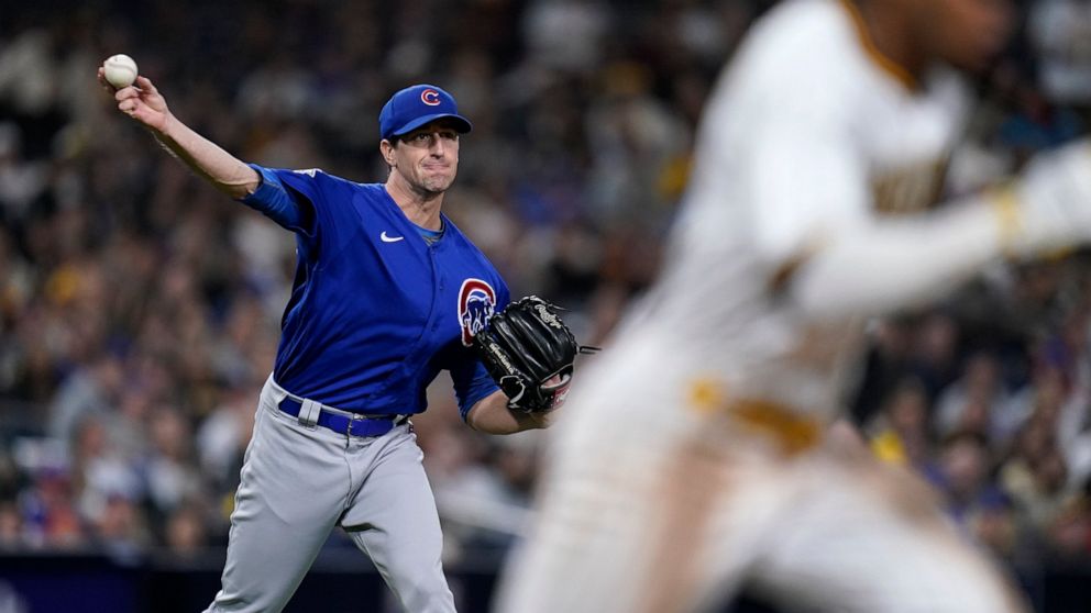 Chicago Cubs starting pitcher Kyle Hendricks throws to first for an out against San Diego Padres' Jose Azocar during the sixth inning of a baseball game Monday, May 9, 2022, in San Diego. (AP Photo/Gregory Bull)