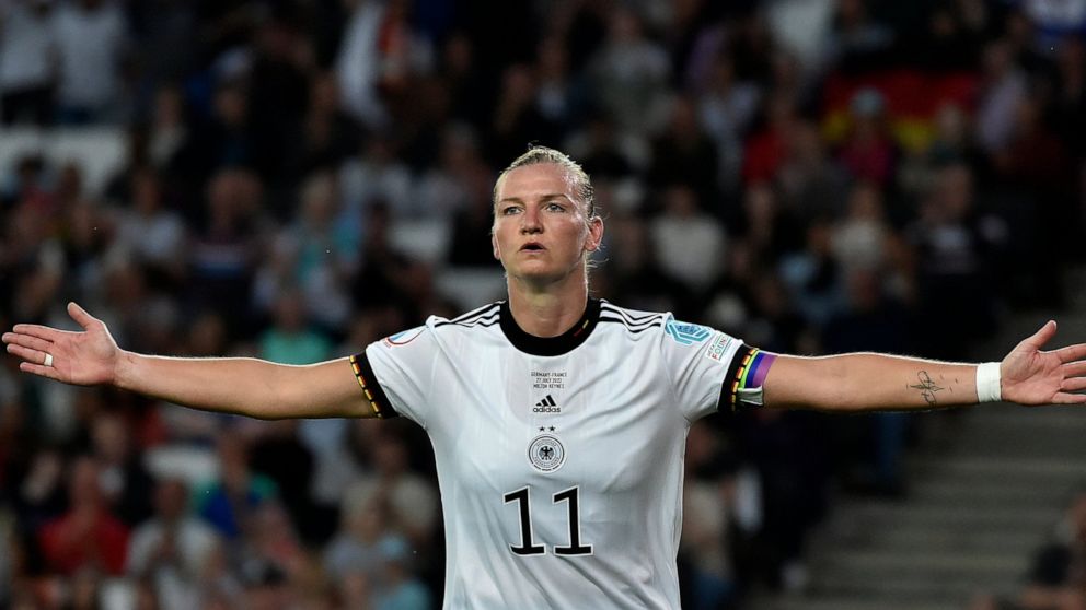 Germany's Alexandra Popp celebrates after scoring her side's first goal during the Women Euro 2022 semi final soccer match between Germany and France at MK stadium in Milton Keynes, England, Wednesday, July 27, 2022. (AP Photo/Rui Vieira)