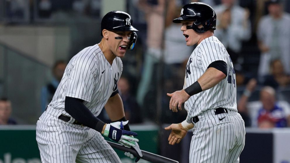 New York Yankees' Harrison Bader celebrates Aaron Judge after scoring against the Pittsburgh Pirates during the fifth inning of a baseball game Tuesday, Sept. 20, 2022, in New York. (AP Photo/Jessie Alcheh)
