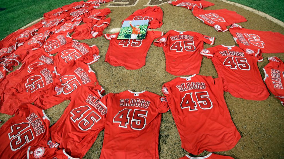 Jerseys with pitcher Tyler Skaggs' number are placed on the mound after the Los Angeles Angels completed a combined no-hitter against the Seattle Mariners during a baseball game Friday, July 12, 2019, in Anaheim, Calif. (AP Photo/Marcio Jose Sanchez)