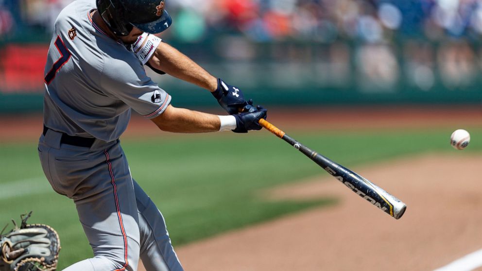 Auburn's Cole Foster (7) hits a three run double in the sixth inning against Stanford during an NCAA College World Series baseball game, Monday, June 20, 2022, in Omaha, Neb. (AP Photo/John Peterson)