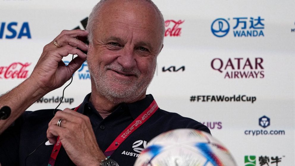 Australia's head coach Graham Arnold adjusts his headphone during a press conference on the eve of the group D World Cup soccer match between France and Australia, in Doha, Qatar, Monday, Nov. 21, 2022. (AP Photo/Ariel Schalit)