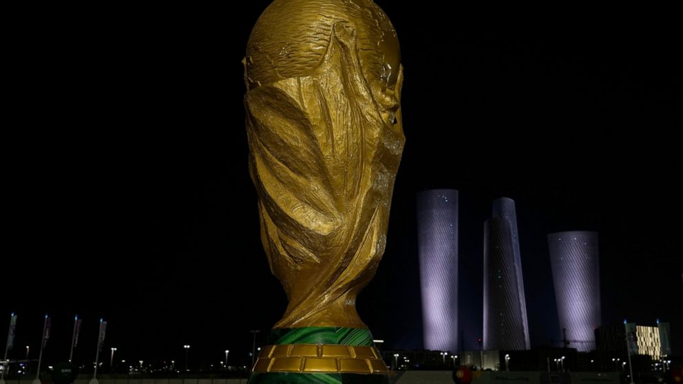 A replica of the World Cup is display outside Lusail Stadium in Lusail in Doha, Qatar, Saturday, Nov. 12, 2022. Final preparations are being made for the soccer World Cup which starts on Nov. 20 when Qatar face Ecuador. (AP Photo/Hassan Ammar)