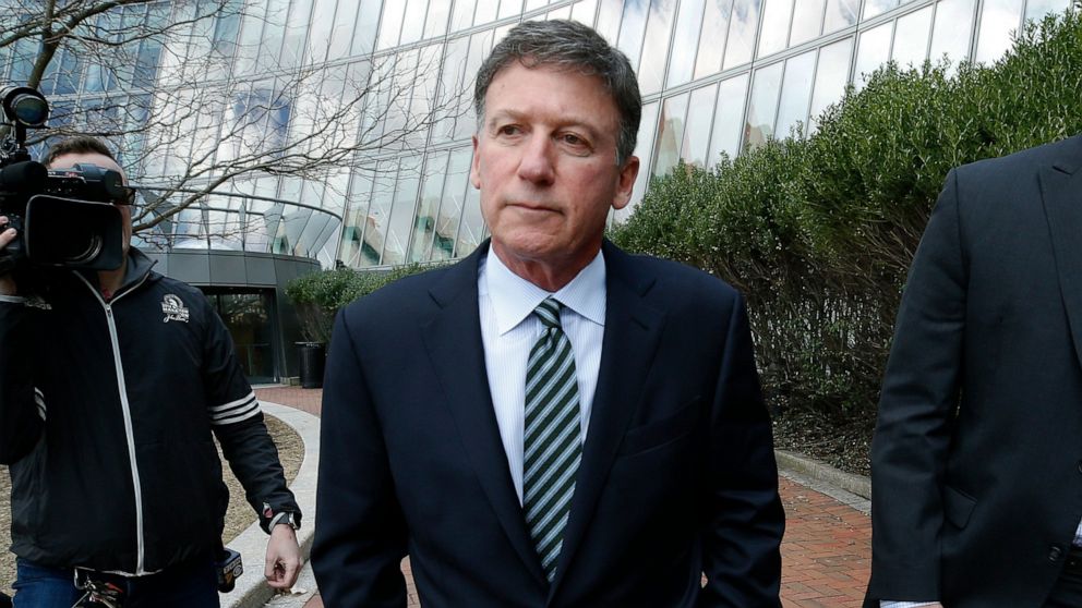 Bruce Isackson departs federal court in Boston on Wednesday, April 3, 2019, after facing charges in a nationwide college admissions bribery scandal.