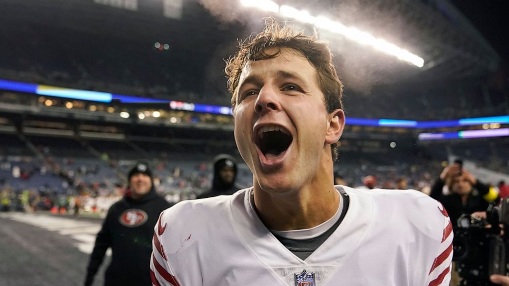 San Francisco 49ers quarterback Brock Purdy celebrates after the 49ers defeated the Seattle Seahawks in an NFL football game in Seattle, Thursday, Dec. 15, 2022. (AP Photo/Marcio Jose Sanchez)