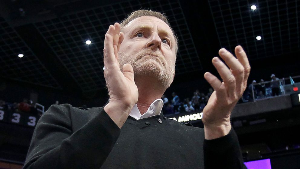 FILE - Phoenix Suns owner Robert Sarver applauds the teams 107-99 victory against the Minnesota Timberwolves during an NBA basketball game, Saturday, Dec. 15, 2018, in Phoenix. The NBA has suspended Phoenix Suns and Phoenix Mercury owner Robert Sarve