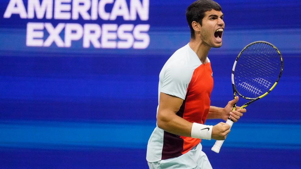 Carlos Alcaraz, of Spain, reacts after scoring a point against Frances Tiafoe, of the United States, during the semifinals of the U.S. Open tennis championships, Friday, Sept. 9, 2022, in New York. (AP Photo/Charles Krupa)
