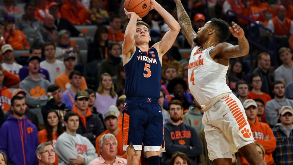 Virginia's Kyle Guy shoots a 3-pointer over Clemson's Shelton Mitchell during the first half of an NCAA college basketball game Saturday, Jan. 12, 2019, in Clemson, S.C. (AP Photo/Richard Shiro)