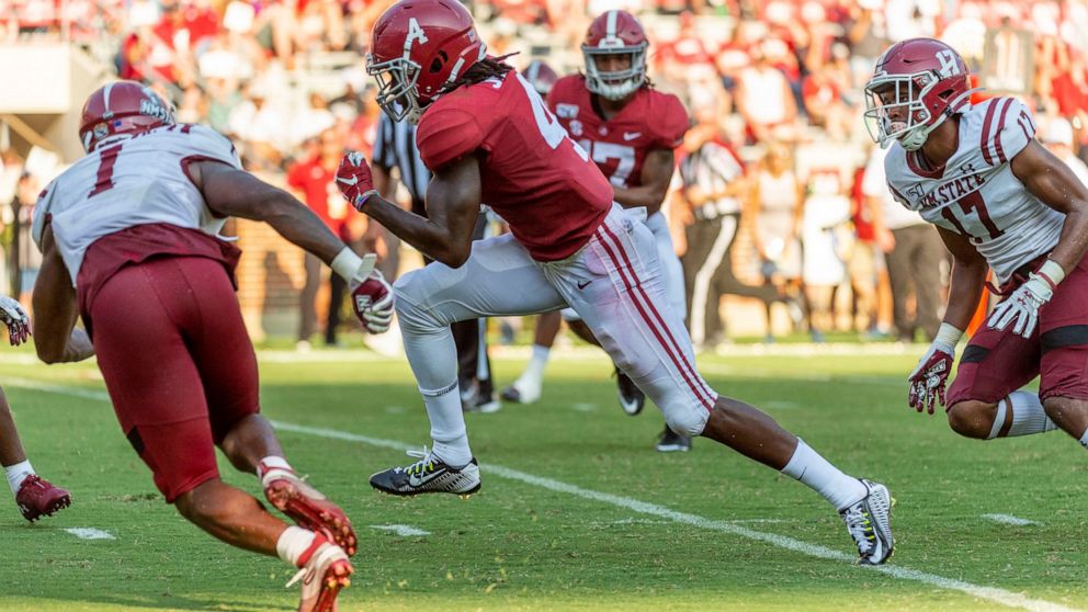 Alabama wide receiver Jerry Jeudy (4) runs a pass reception win for a 19-yard touchdown against New Mexico State during the second half of an NCAA college football game Saturday, Sept. 7, 2019, in Tuscaloosa, Ala. (AP Photo/Vasha Hunt)