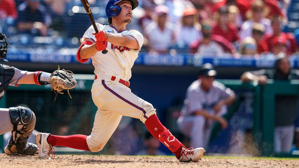 Philadelphia Phillies' Bryson Stott hits a three-ru home run during the ninth inning of a baseball game against the Miami Marlins, Wednesday, June 15, 2022, in Philadelphia. The Phillies won 3-1. (AP Photo/Chris Szagola)