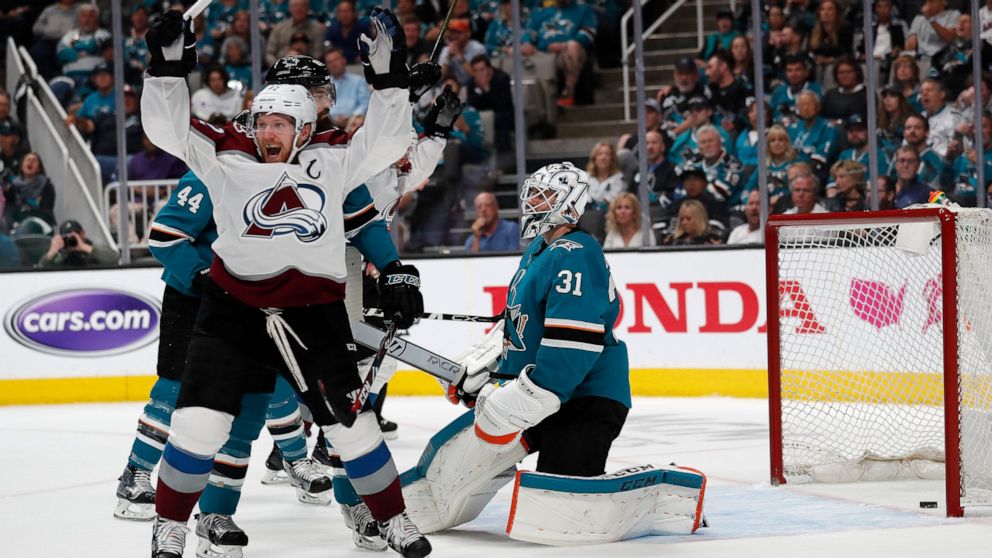 Colorado Avalanche's Gabriel Landeskog (92) celebrates a goal against San Jose Sharks goaltender Martin Jones (31) by teammate Tyson Barrie (not shown) in the second period of Game 2 of an NHL hockey second-round playoff series at the SAP Center in S