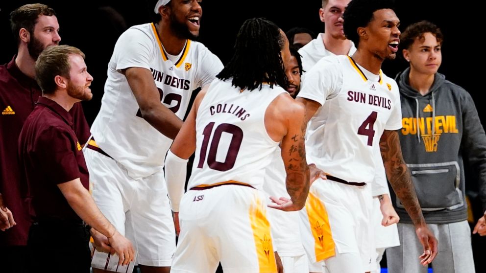 Arizona State's Desmond Cambridge Jr. (4) reacts after scoring during the second half of an NCAA college basketball game against Virginia Commonwealth at the Legends Classic Wednesday, Nov. 16, 2022, in New York. Arizona State won 63-59. (AP Photo/Fr