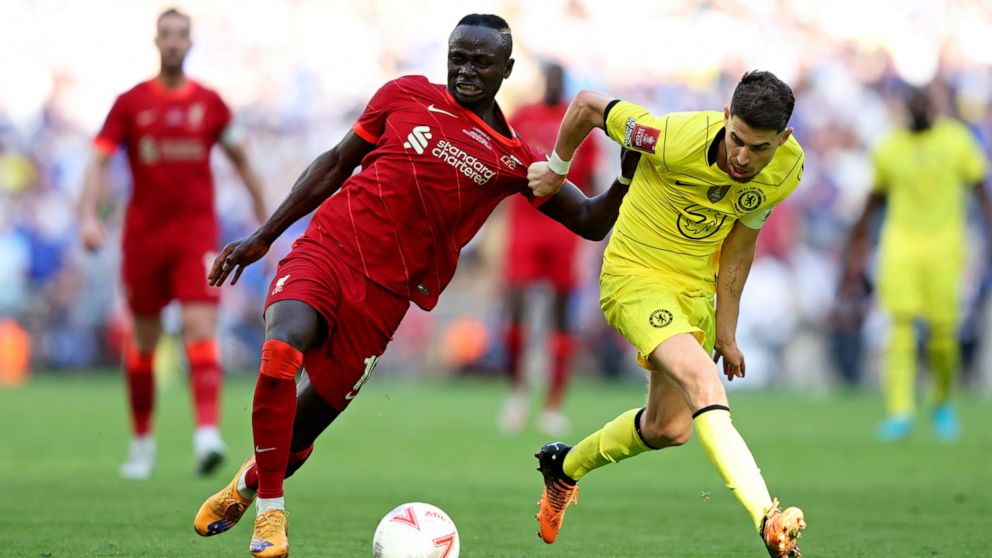 Chelsea's Jorginho, right, fights for the ball with Liverpool's Sadio Mane during the English FA Cup final soccer match between Chelsea and Liverpool, at Wembley stadium, in London, Saturday, May 14, 2022. (AP Photo/Ian Walton)
