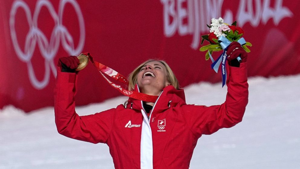 Lara Gut-Behrami, of Switzerland celebrates during the medal ceremony after winning the gold medal in the women's super-G at the 2022 Winter Olympics, Friday, Feb. 11, 2022, in the Yanqing district of Beijing. (AP Photo/Robert F. Bukaty)