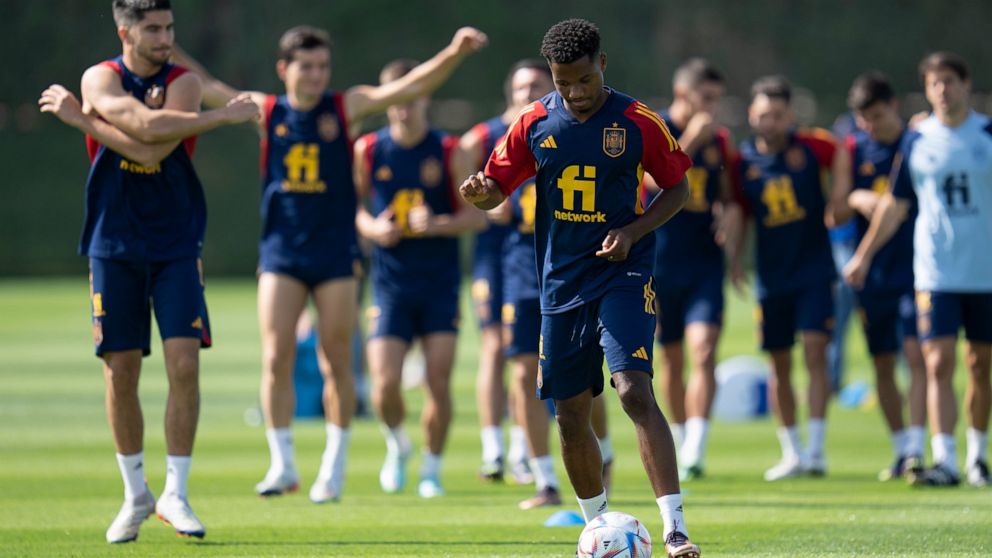 Spain's Ansu Fati works out during a training session at Qatar University, in Doha, Qatar, Tuesday, Nov. 29, 2022. Spain will play its first final match in Group E in the World Cup against Japan on Dec. 1. (AP Photo/Julio Cortez)