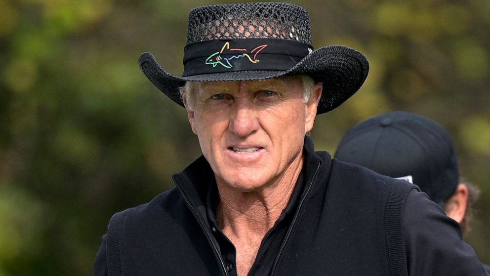 FILE - Greg Norman walks on the first hole after hitting his tee shot during the final round of the PNC Championship golf tournament, Sunday, Dec. 20, 2020, in Orlando, Fla. Norman has had his share of rough Sundays in major championships. He had ano