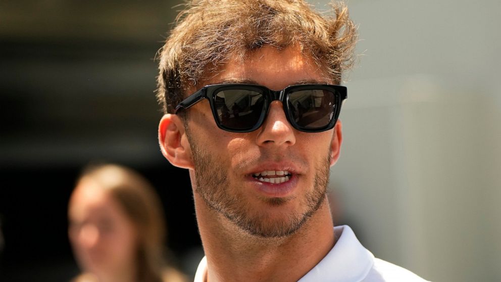 AlphaTauri driver Pierre Gasly of France arrives prior to the third free practice at the Baku circuit, in Baku, Azerbaijan, Saturday, June 11, 2022. The Formula One Grand Prix will be held on Sunday. (AP Photo/Sergei Grits)