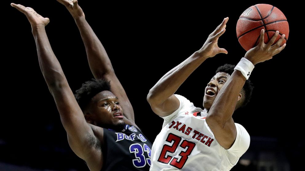 FILE - In this March 24, 2019, file photo, Texas Tech's Jarrett Culver (23) shoots past Buffalo's Nick Perkins (33) during the second half of a second round men's college basketball game in the NCAA Tournament, in Tulsa, Okla. With the No. 5 and 26 p