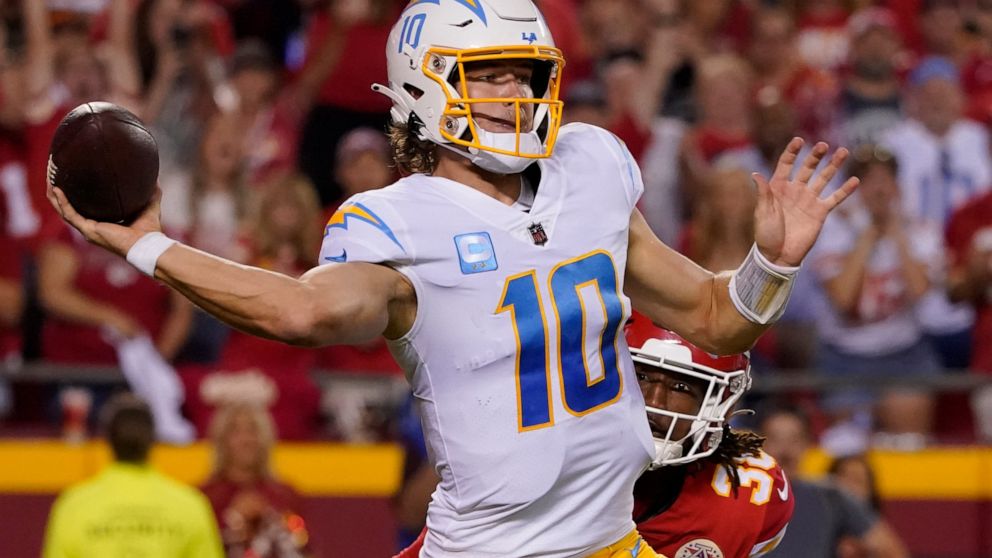 Los Angeles Chargers quarterback Justin Herbert throws during the second half of an NFL football game against the Kansas City Chiefs Thursday, Sept. 15, 2022, in Kansas City, Mo. (AP Photo/Ed Zurga)