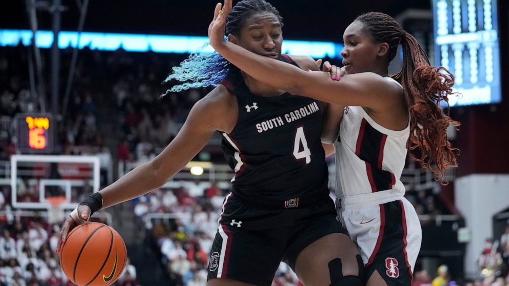 South Carolina forward Aliyah Boston (4) drives to the basket while defended by Stanford forward Kiki Iriafen, right, during the first half of an NCAA college basketball game in Stanford, Calif., Sunday, Nov. 20, 2022. (AP Photo/Godofredo A. Vásquez)