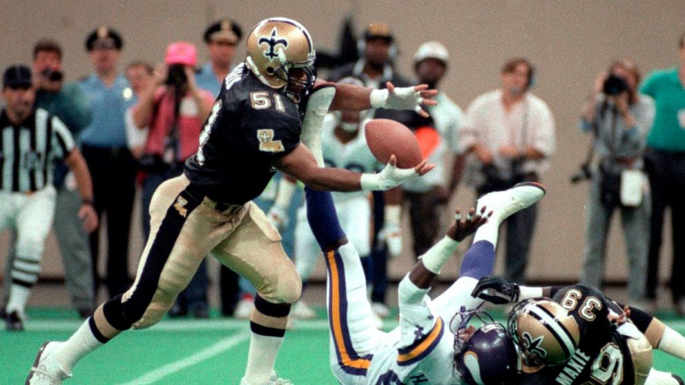 FILE - New Orleans Saints' Sam Mills grabs a fumble during the team's NFL football game against the Minnesota Vikings on Sept. 22, 1991, in New Orleans. Mills played Division III college football and was not drafted. That made his rise to stardom wit