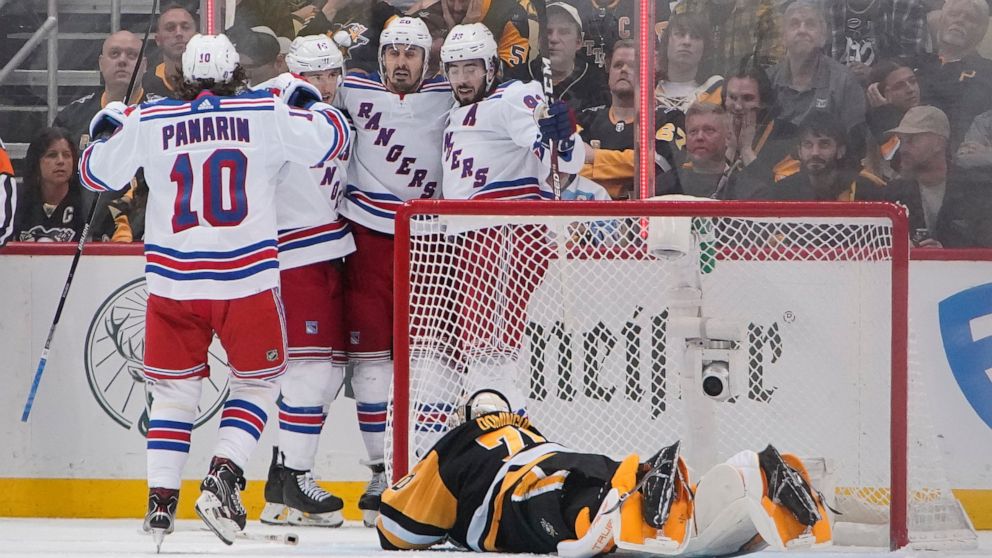 New York Rangers' Chris Kreider (20) celebrates after scoring against the Pittsburgh Pirates during the second period in Game 6 of an NHL hockey Stanley Cup first-round playoff series in Pittsburgh, Friday, May 13, 2022. (AP Photo/Gene J. Puskar)