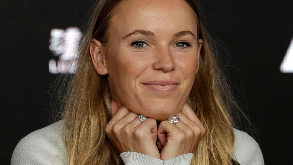 Defending women's singles champion Denmark's Caroline Wozniacki answers questions during a press conference at the Australian Open tennis championships in Melbourne, Australia, Sunday, Jan. 13, 2019. (AP Photo/Kin Cheung)