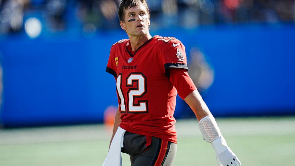Tampa Bay Buccaneers quarterback Tom Brady (12) looks at the scoreboard after failing to convert a fourth down play in the fourth quarter during the second half of an NFL football game against the Carolina Panthers Sunday, Oct. 23, 2022, in Charlotte