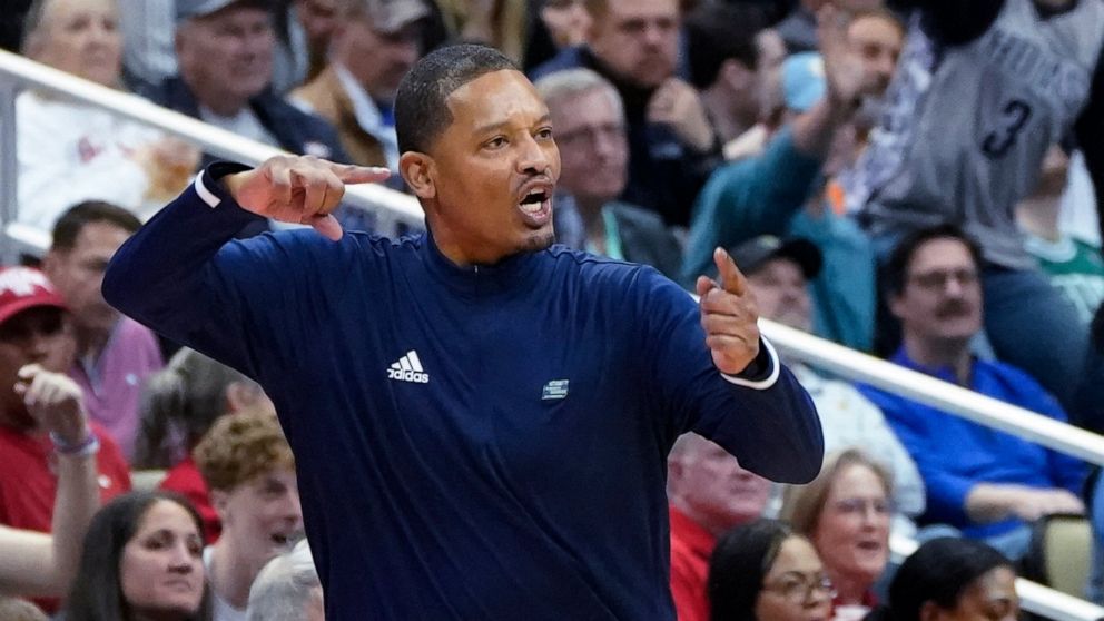 Chattanooga coach Lamont Paris gestures after the ball went out of bounds on a bad pass against Illinois during the second half of a college basketball game in the first round of the NCAA men's tournament Friday, March 18, 2022, in Pittsburgh. (AP Ph