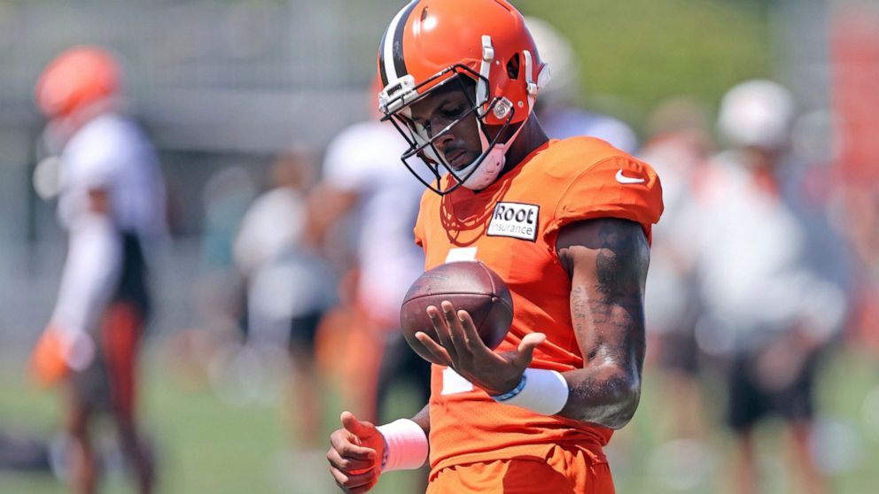 Cleveland Browns quarterback Deshaun Watson works out during a joint practice with the Philadelphia Eagles at NFL football training camp, Thursday, Aug. 18, 2022, in Berea, Ohio,. Watson has reached a settlement with the NFL and will serve an 11-game