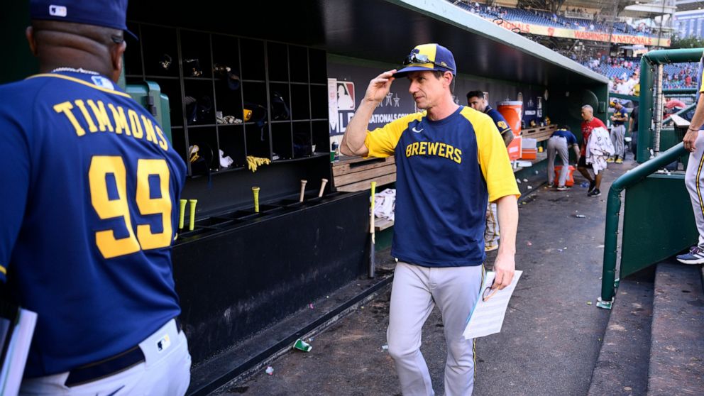 Milwaukee Brewers manager Craig Counsell walks in the dugout after a baseball game against the Washington Nationals, Sunday, June 12, 2022, in Washington. (AP Photo/Nick Wass)