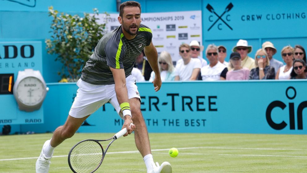 Marin Cilic of Croatia plays a return to Cristian Garin of Chile during their singles match at the Queens Club tennis tournment in London, Monday, June 17, 2019. (AP Photo/Kirsty Wigglesworth)