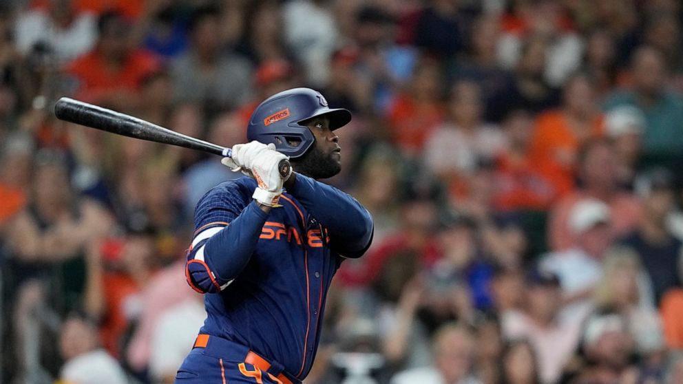 Houston Astros' Yordan Alvarez hits a sacrifice fly to score Jose Altuve during the third inning of a baseball game against the Boston Red Sox Monday, Aug. 1, 2022, in Houston. (AP Photo/David J. Phillip)
