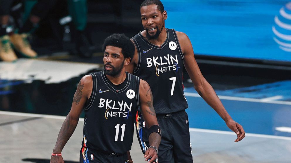FILE - Brooklyn Nets guard Kyrie Irving (11) and Kevin Durant react against the Boston Celtics in the second half of Game 5 during an NBA basketball first-round playoff series, June 1, 2021, in New York. Kevin Durant said Friday, Nov. 4, 2022, the Br