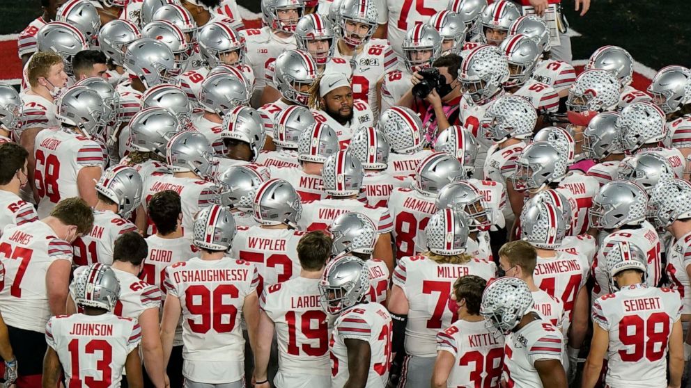 FILE - Ohio State gathers before an NCAA College Football Playoff national championship game against Alabama in Miami Gardens, Fla., Jan. 11, 2021. In 2019, California became the first state to pass a law allowing athletes to earn money on endorsemen