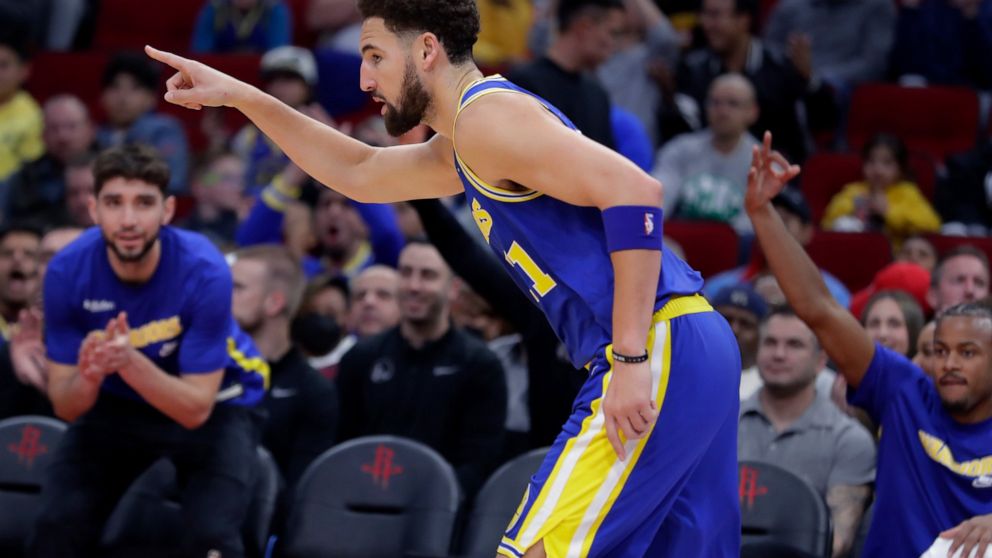 Golden State Warriors guard Klay Thompson reacts after making a 3-point basket against the Houston Rockets during the first half of an NBA basketball game Sunday, Nov. 20, 2022, in Houston. (AP Photo/Michael Wyke)