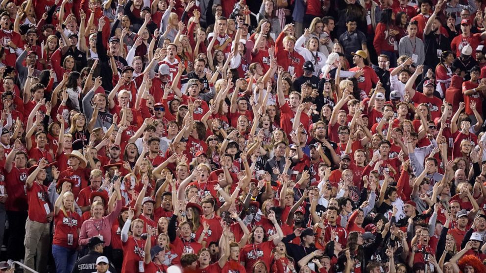 The Utah student section show their support during the first half of an NCAA college football game against San Diego State and Utah Saturday, Sept. 17, 2022, in Salt Lake City. A University of Utah student was arrested on suspicion of making terroris