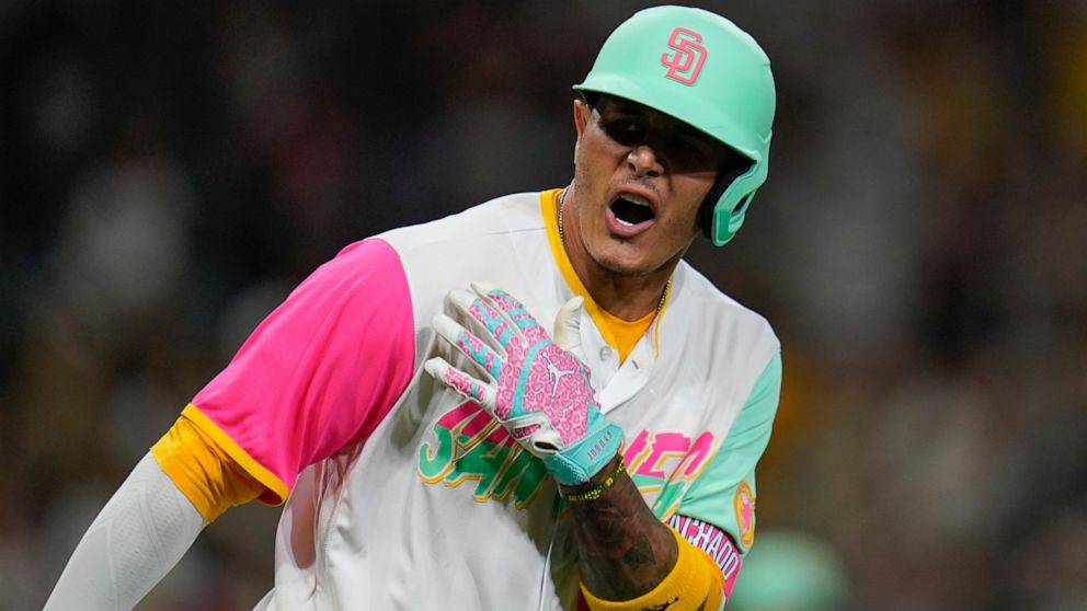 San Diego Padres' Manny Machado reacts after hitting a two-run home run during the fifth inning of a baseball game against the Minnesota Twins, Friday, July 29, 2022, in San Diego. (AP Photo/Gregory Bull)
