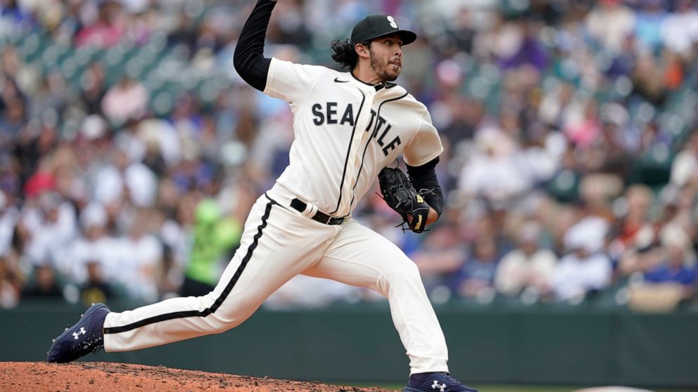 Seattle Mariners pitcher Andres Munoz throws against the Los Angeles Angels during the sixth inning of the first baseball game of a doubleheader, Saturday, June 18, 2022, in Seattle. (AP Photo/Ted S. Warren)