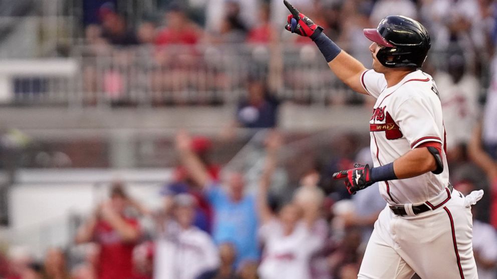Atlanta Braves' Austin Riley celebrates after hitting a two-run home run against the St. Louis Cardinals during the first inning of a baseball game Tuesday, July 5, 2022, in Atlanta. (AP Photo/Brynn Anderson)