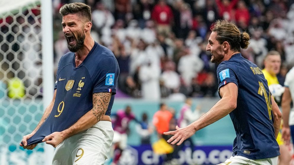 France's Olivier Giroud celebrates after scoring his side's second goal during the World Cup quarterfinal soccer match between England and France, at the Al Bayt Stadium in Al Khor, Qatar, Saturday, Dec. 10, 2022. (AP Photo/Christophe Ena)