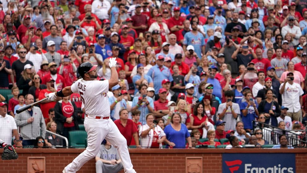 St. Louis Cardinals' Albert Pujols watches his two-run home run during the eighth inning of a baseball game against the Chicago Cubs Sunday, Sept. 4, 2022, in St. Louis. (AP Photo/Jeff Roberson)