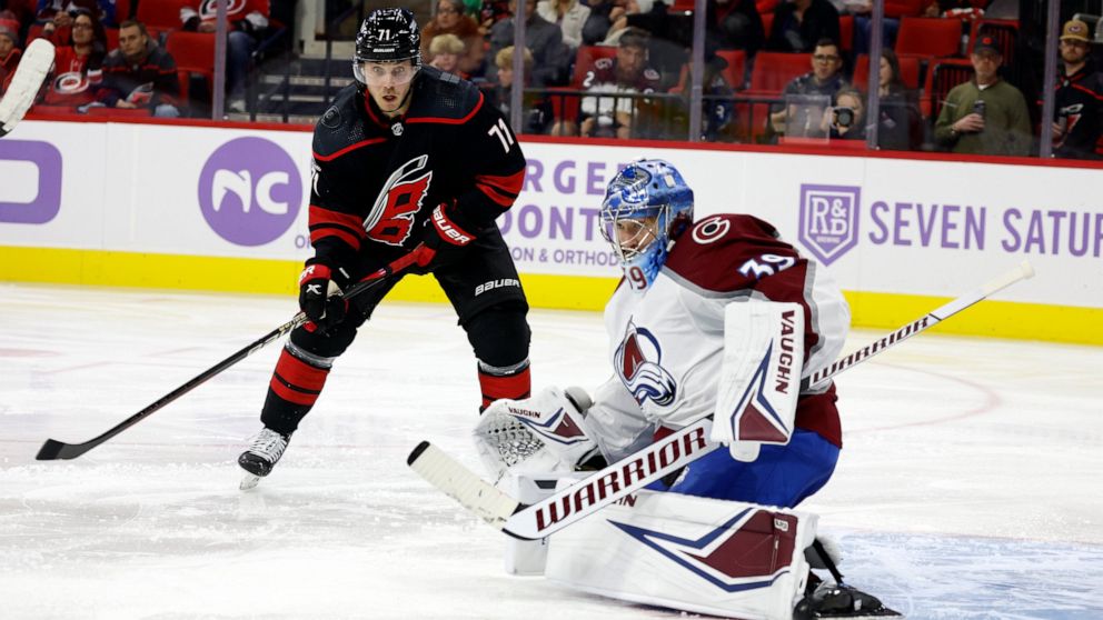 Carolina Hurricanes' Jesper Fast (71) has his shot bounce off Colorado Avalanche goaltender Pavel Francouz (39) during the second period of an NHL hockey game in Raleigh, N.C., Thursday, Nov. 17, 2022. (AP Photo/Karl B DeBlaker)